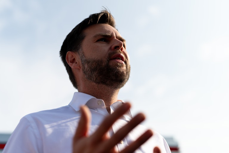 J.D. Vance gestures as he speaks at a campaign rally
