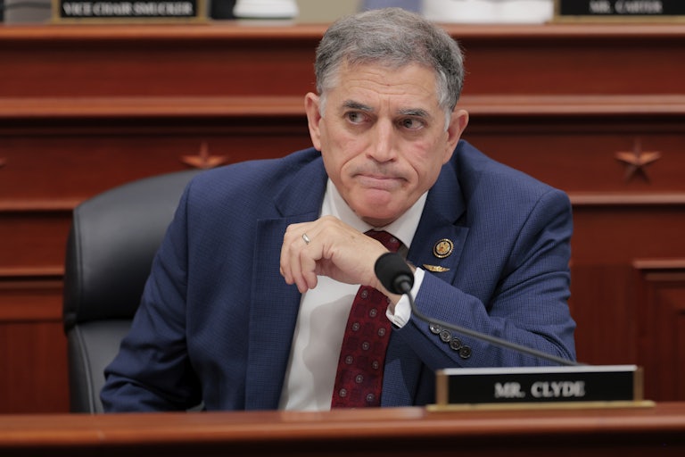 Representative Andrew Clyde sits in a congressional meeting.