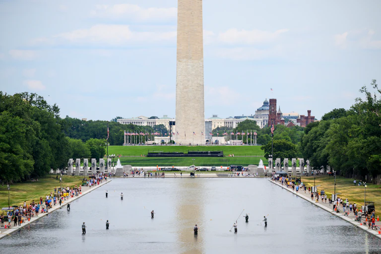 The Washington Monument is visible behind the Lincoln Memorial Reflecting Pool on Sunday, June 21.