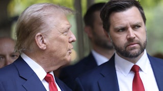 Trump turns toward Vance, with people behind them.