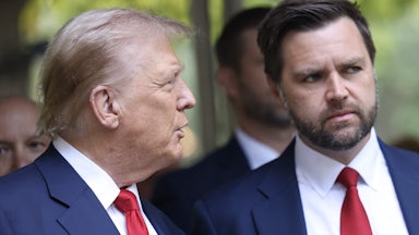 Trump turns toward Vance, with people behind them.