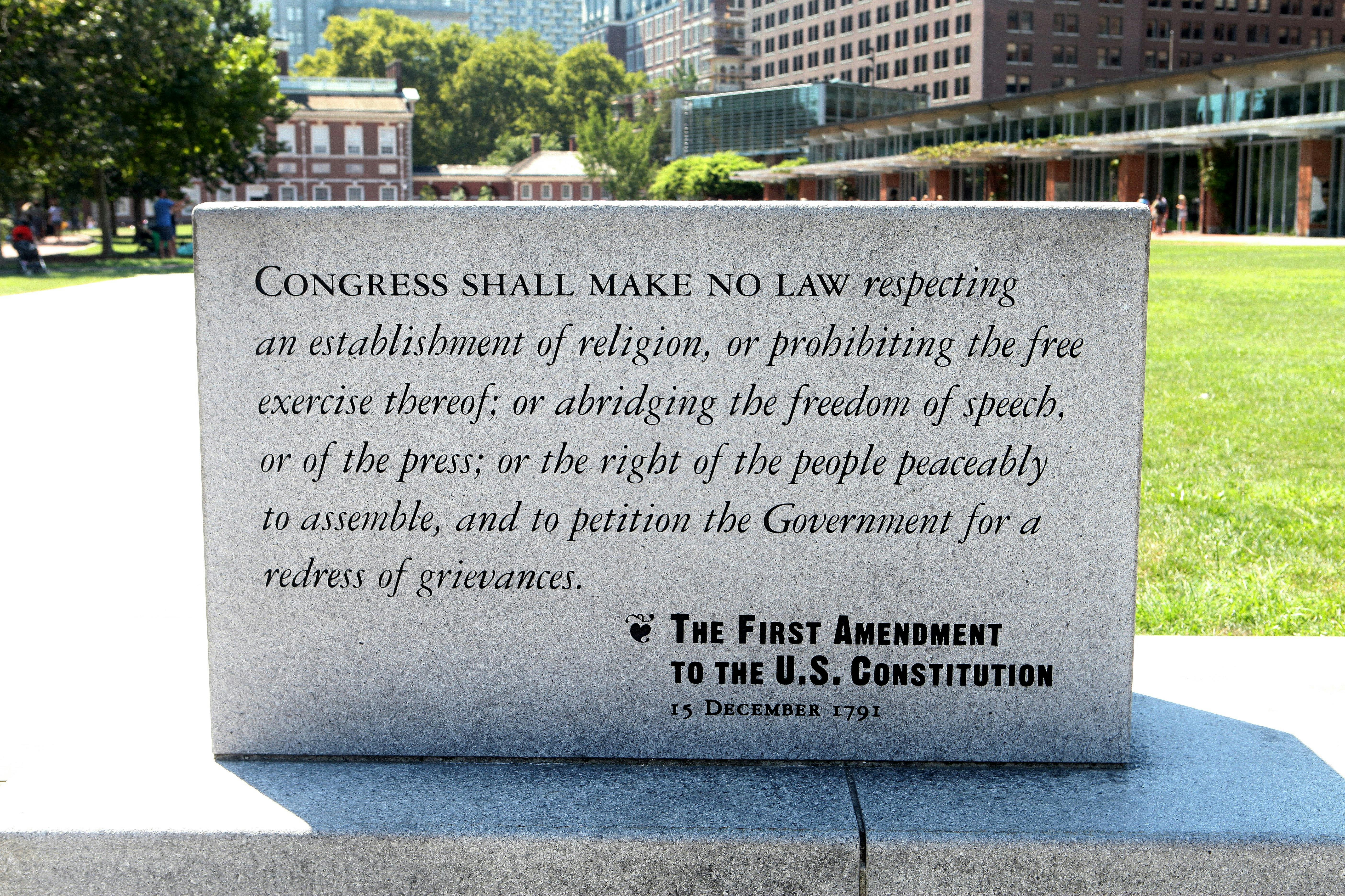 A marble plaque reading of the First Amendment To The U.S. Constitution sits on Independence Mall in Philadelphia.