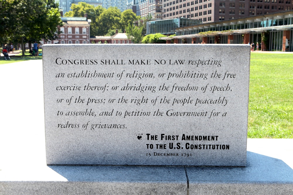 A marble plaque reading of the First Amendment To The U.S. Constitution sits on Independence Mall in Philadelphia.
