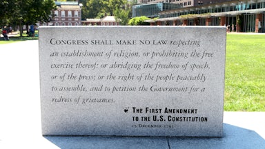 A marble plaque reading of the First Amendment To The U.S. Constitution sits on Independence Mall in Philadelphia.