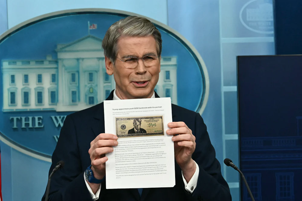 Treasury Secretary Scott Bessent shows a proposed $250 bill featuring President Donald Trump during a press briefing in the Brady Briefing Room of the White House.