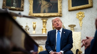 Donald Trump speaks during a meeting in the Oval Office.
