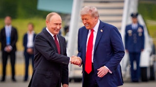 Russian President Vladimir Putin and Donald Trump smile and shake hands on the tarmac at Joint Base Elmendorf-Richardson in Alaska