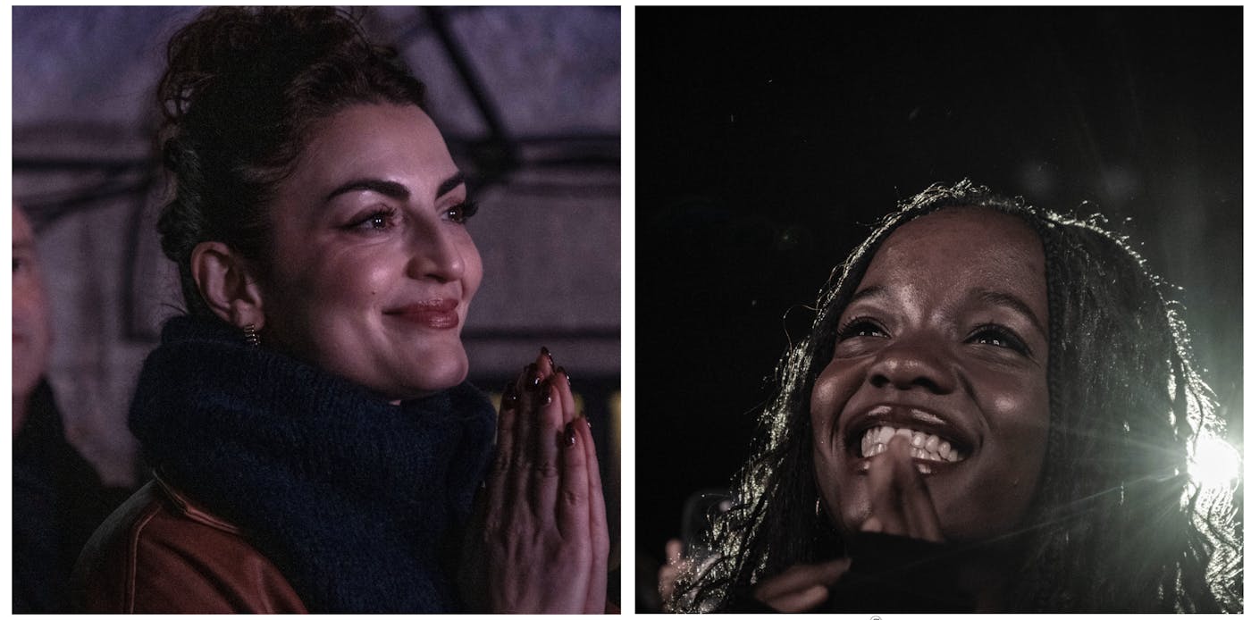 Two women watch Mamdani speak
