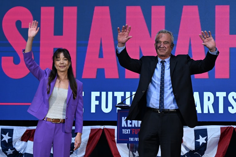 Nicole Shanahan and Robert F. Kennedy Jr. wave during a campaign event