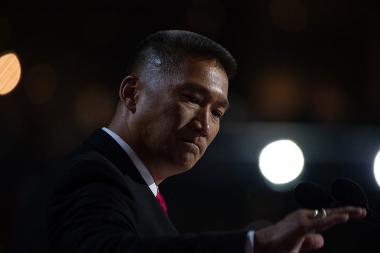 Hung Cao appears sad and looks downward