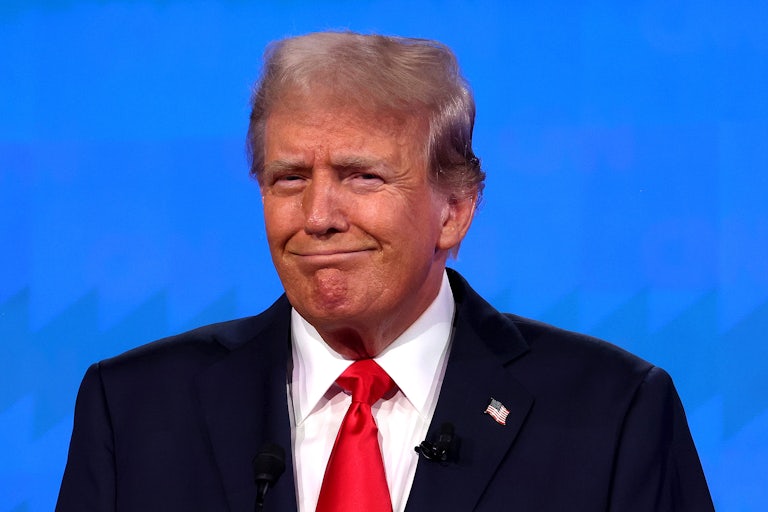 Donald Trump does a toothless smile at Thursday's presidential debate.