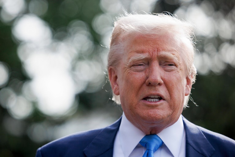 Donald Trump speaks to reporters outside the White House
