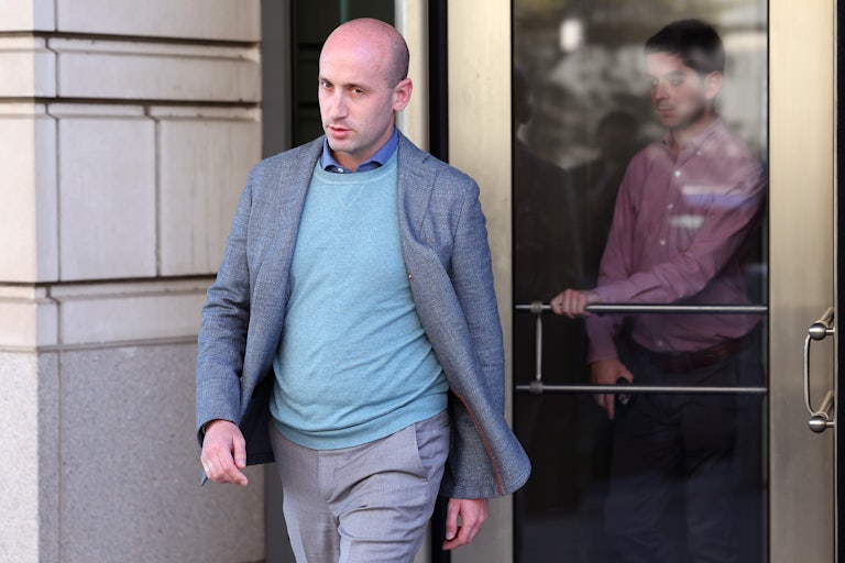 Stephen Miller walks out of a courthouse