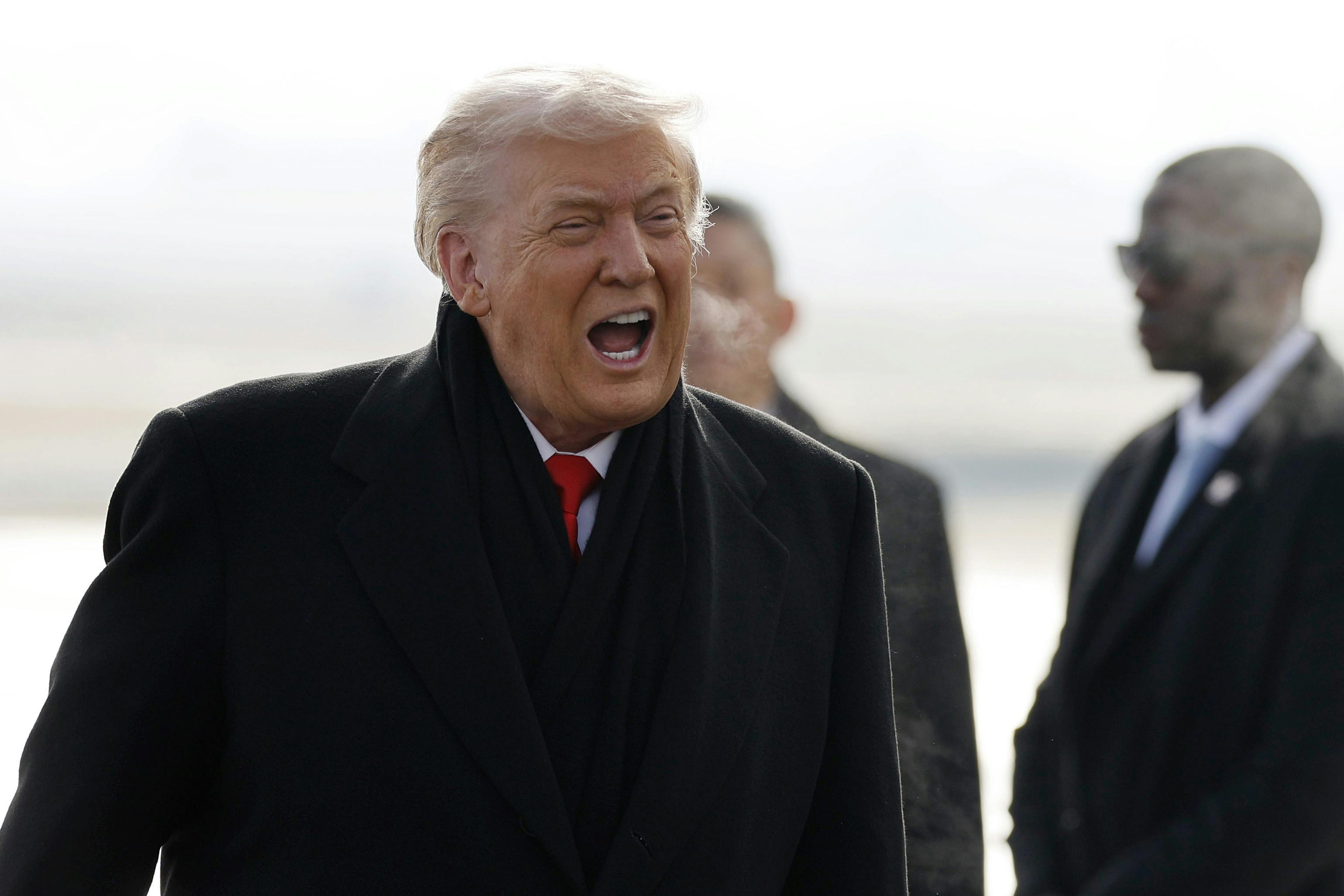 Donald Trump speaks loudly with open mouth