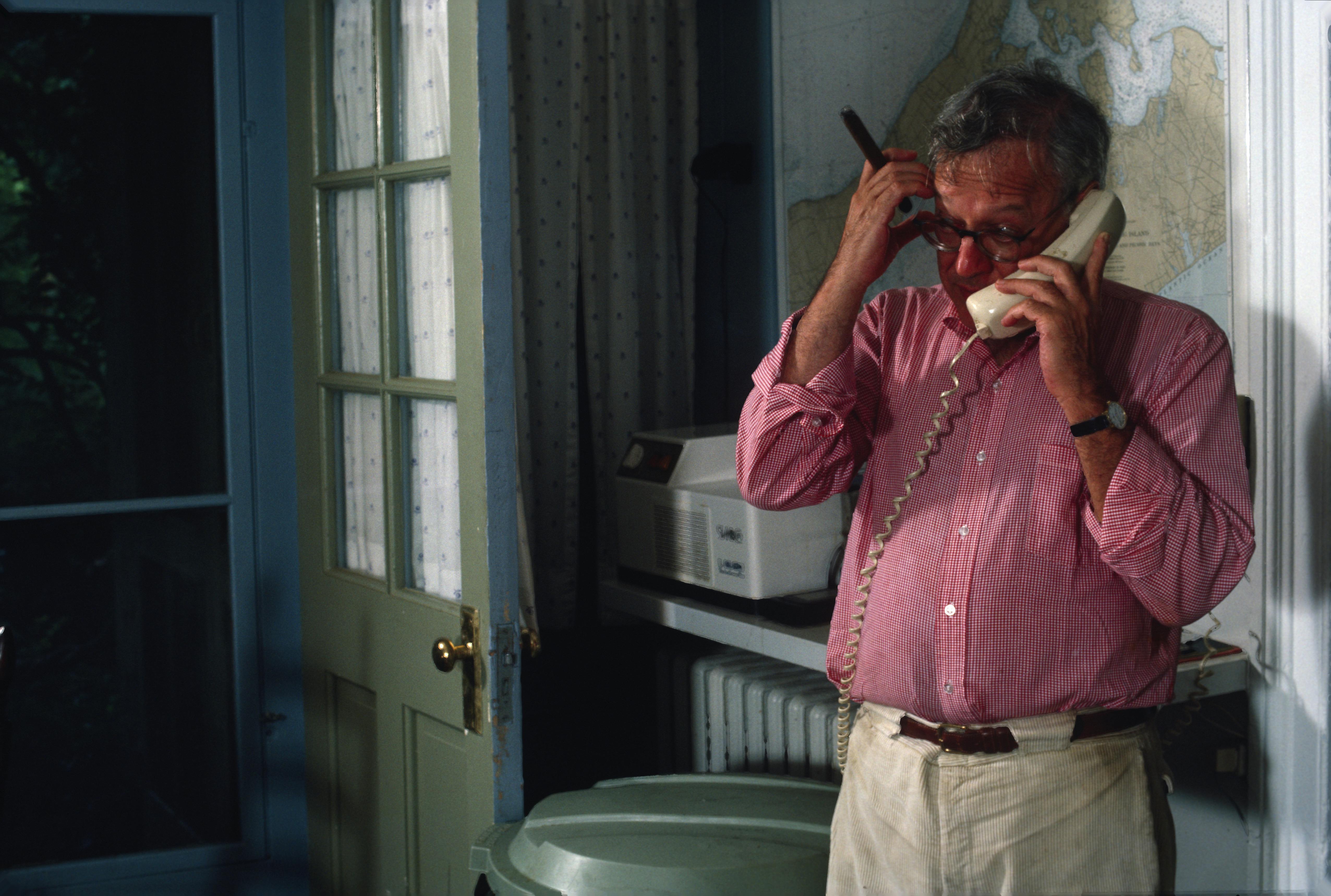 The writer and publisher Jason Epstein on the phone at his home, Sag Harbor, New York, in 1984