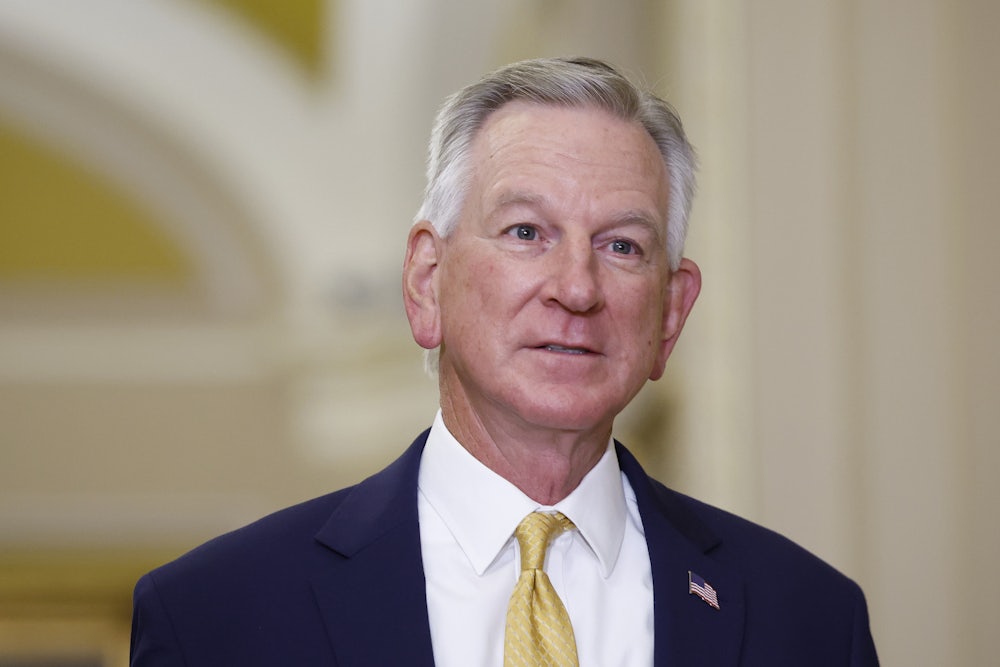 Tommy Tuberville walks in the Senate