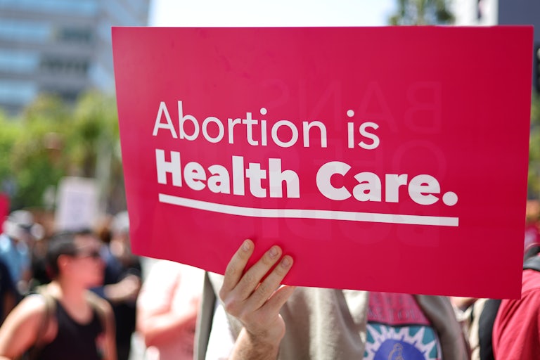 A person holds up a pro-abortion sign at a protest
