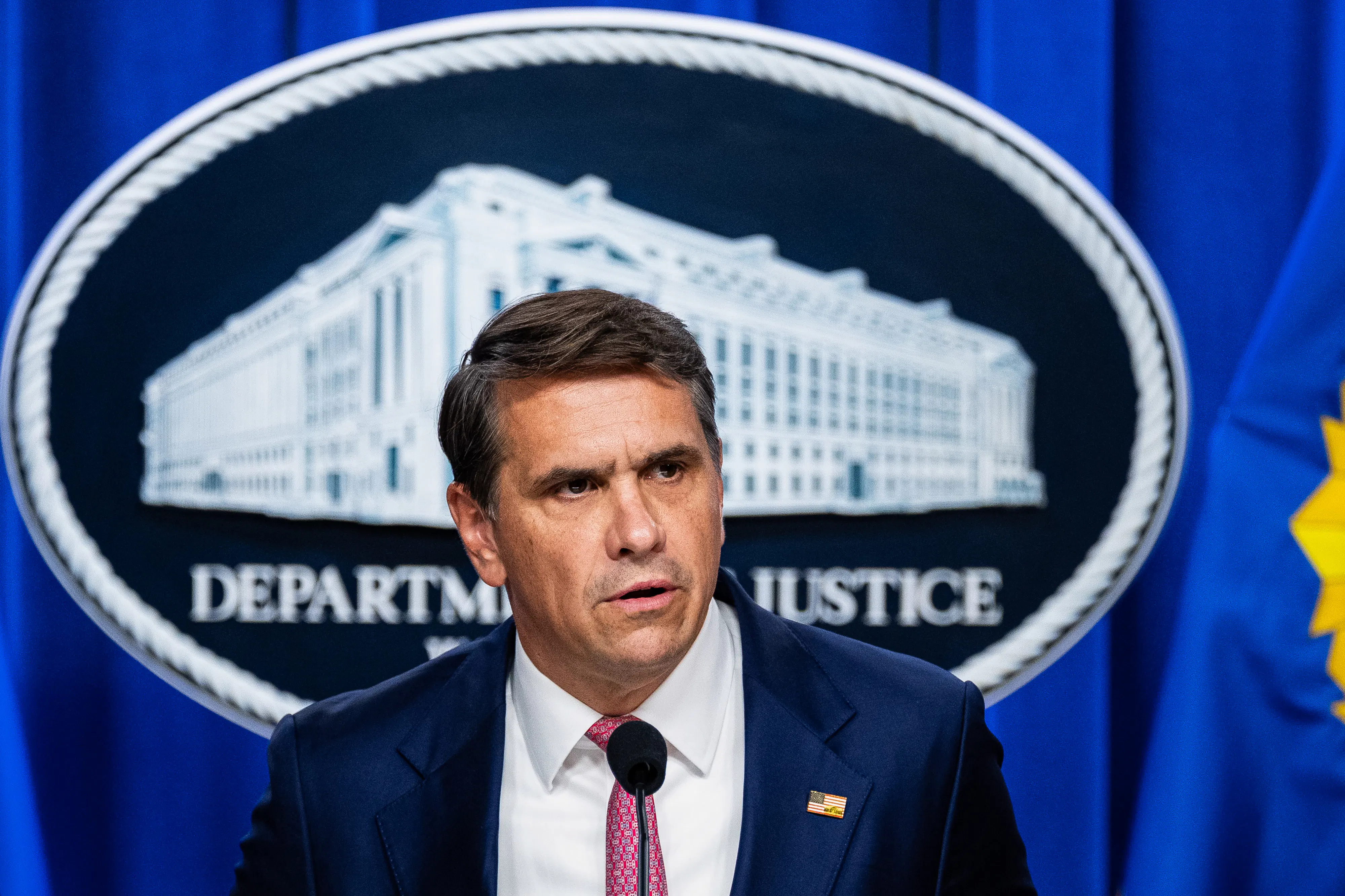 Acting Attorney General Todd Blanche speaks at a podium