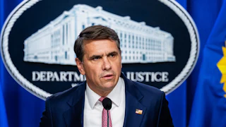 Acting Attorney General Todd Blanche speaks at a podium