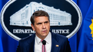 Acting Attorney General Todd Blanche speaks at a podium