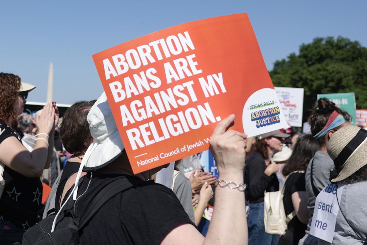 A protester carries a sign as they attend the "Jewish Rally for Abortion Justice" rally on May 17, 2022 in Washington, DC.