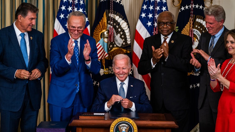 Biden signs the Inflation Reduction Act into law