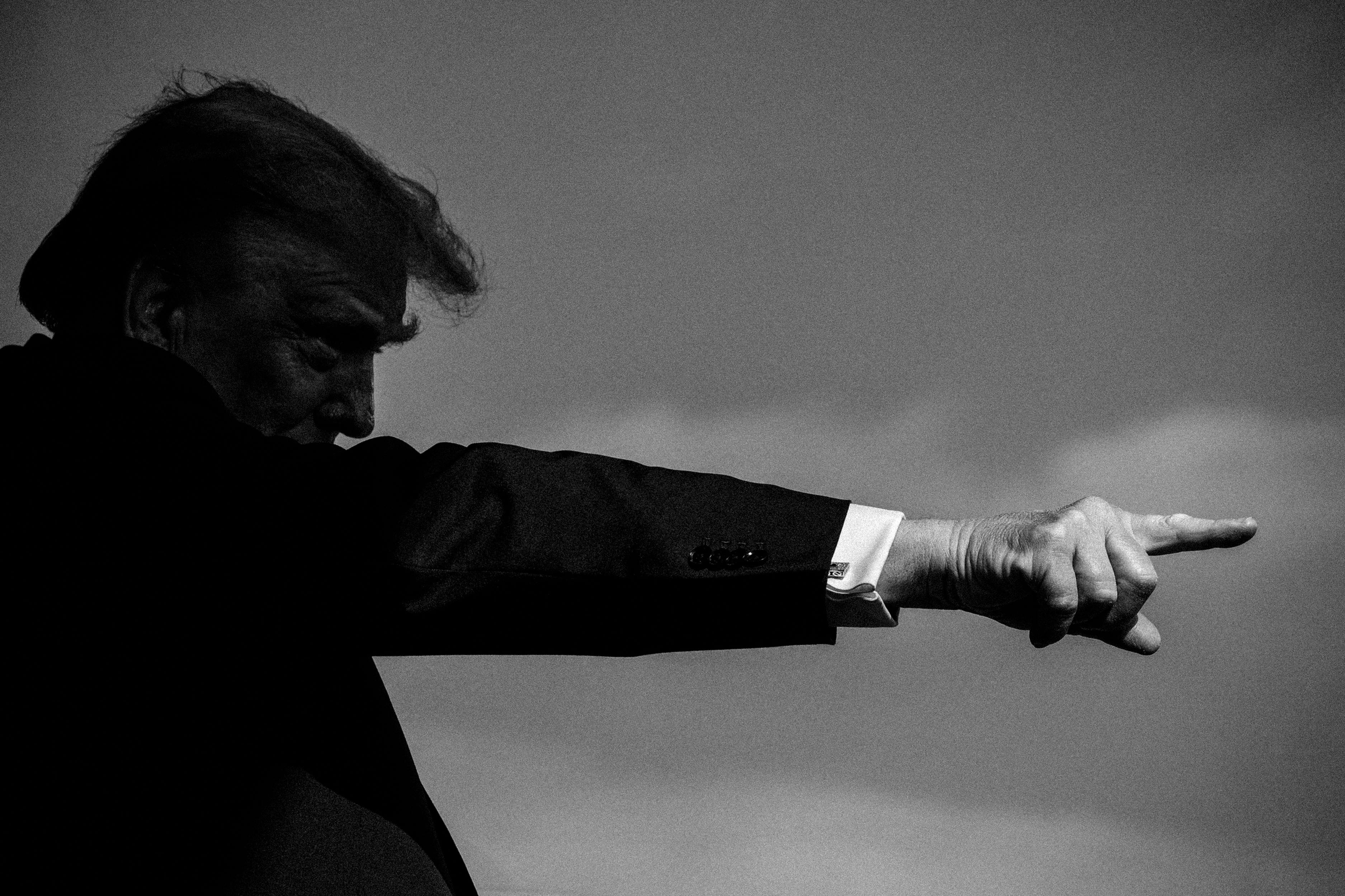 Donald Trump giving a speech and pointing