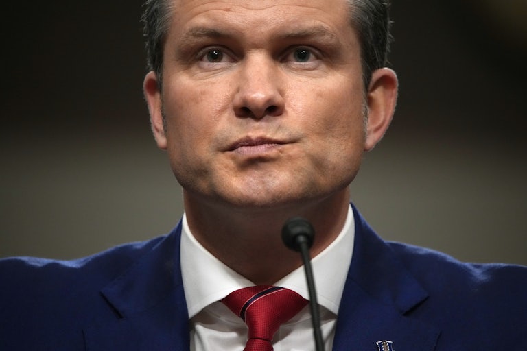 Pete Hegseth purses his lips as if in anxiety, during his confirmation hearing
