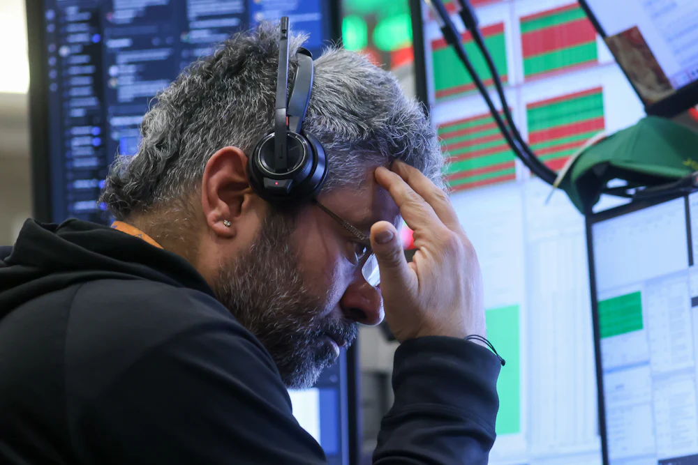 A trader at the New York Stock Exchange