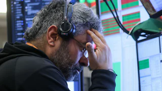 A trader at the New York Stock Exchange