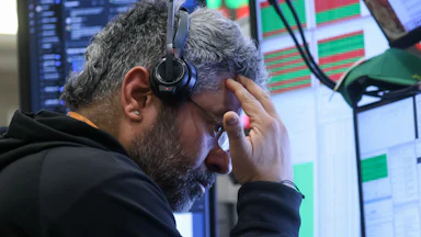 A trader at the New York Stock Exchange