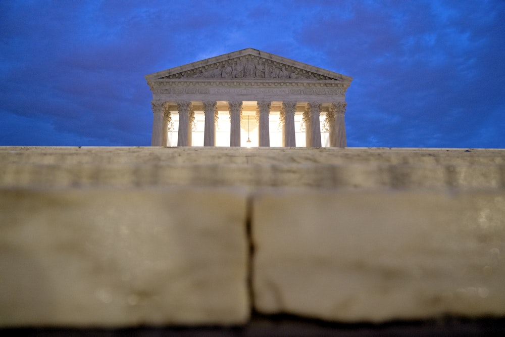 The facade of the Supreme Court can be seen at sunrise.