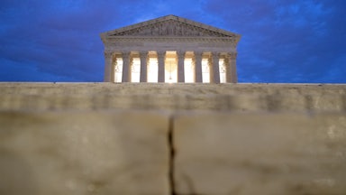 The facade of the Supreme Court can be seen at sunrise.
