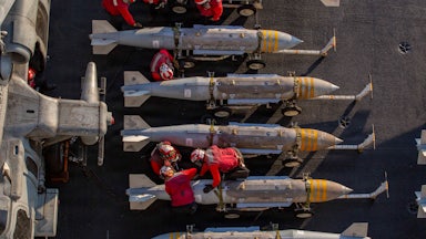 The U.S. Navy prepares to stage ordnance on the flight deck of aircraft carrier USS Abraham Lincoln in support of Operation Epic Fury on February 28, 2026