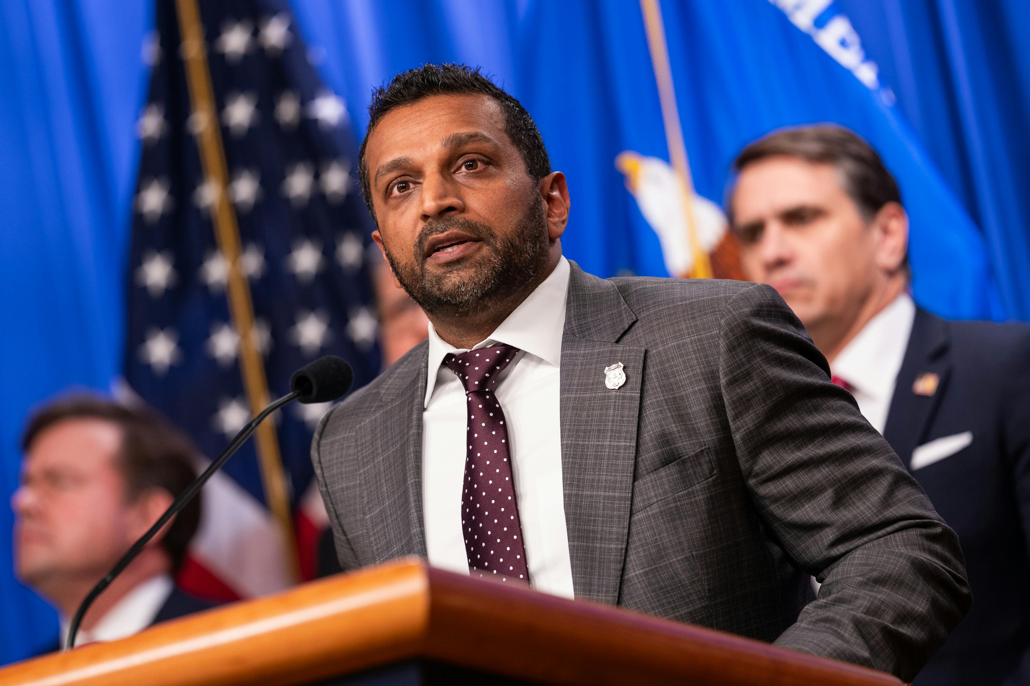 FBI Director Kash Patel speaks at a podium