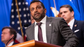 FBI Director Kash Patel speaks at a podium