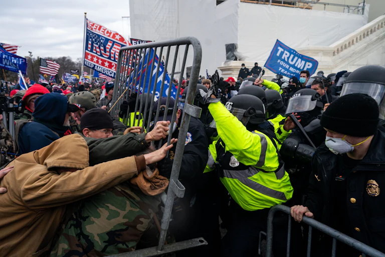 Pro-Trump supporters clash with law enforcement on the west steps of the U.S. Capitol on January 6, 2021.
