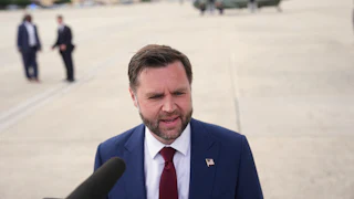 Vice President JD Vance speaks to reporters on an airport tarmac