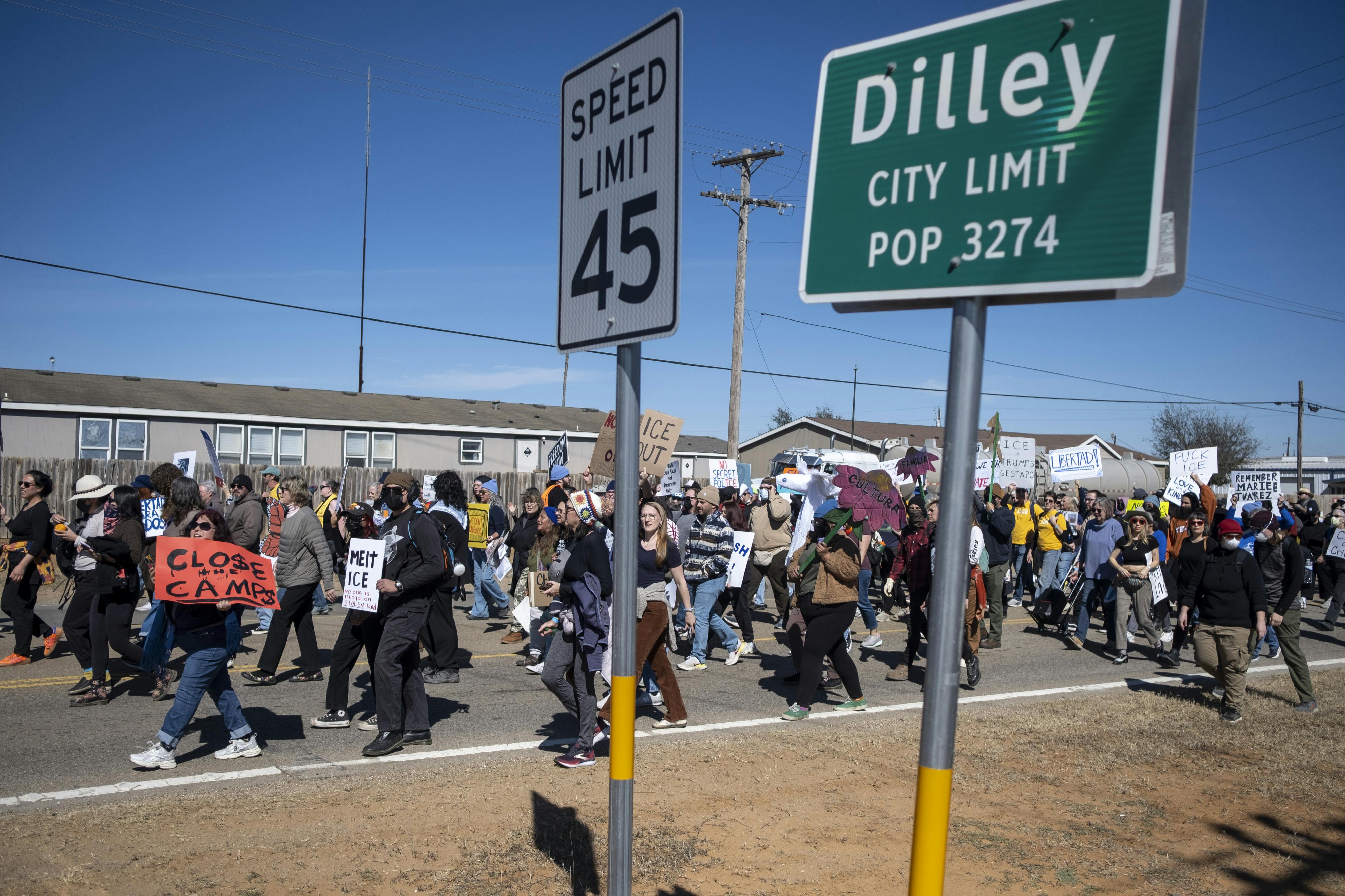People protest against immigration detention centers in Dilley, Texas