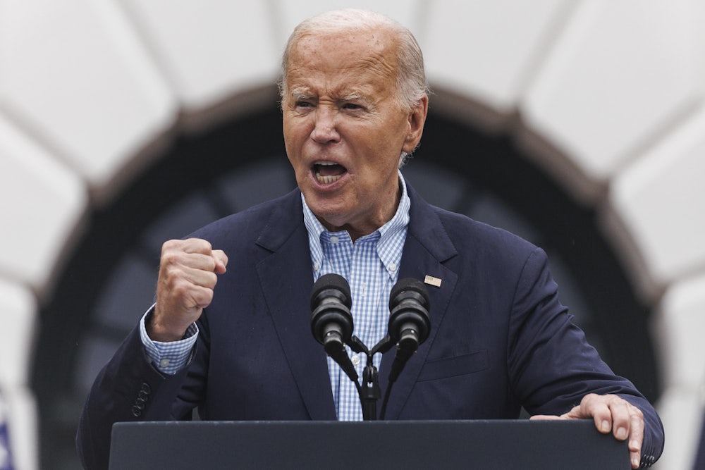 President Biden speaking at the White House with clenched right fist