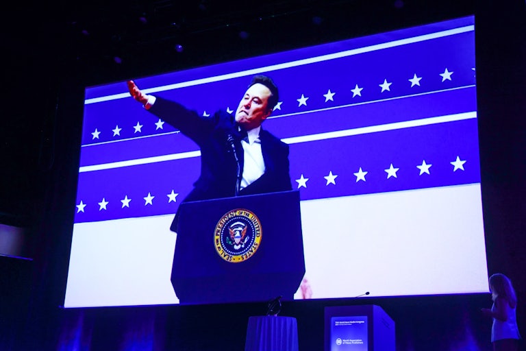A photo of Elon Musk doing a Roman salute is displayed at the World News Media Congress in Krakow, Poland