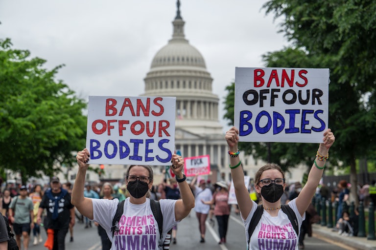 Cynthia Staats and her daughter Sabrina march near the US Capitol as part of the 2022 "Bans Off Our Bodies" abortion-rights rally in Washington, DC. 