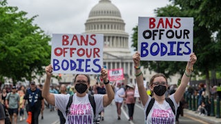Cynthia Staats and her daughter Sabrina march near the US Capitol as part of the 2022 "Bans Off Our Bodies" abortion-rights rally in Washington, DC.