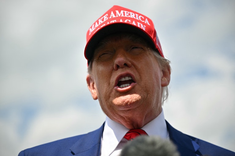 Donald Trump speaks to reporters after disembarking from Air Force One