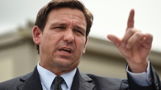 Governor Ron DeSantis gestures while speaking.