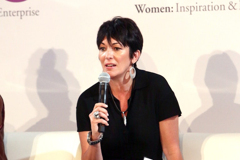 Ghislaine Maxwell speaks in a handheld microphone.