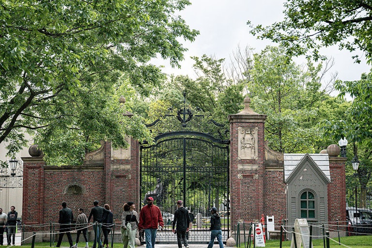 Students walk on Harvard University’s campus.