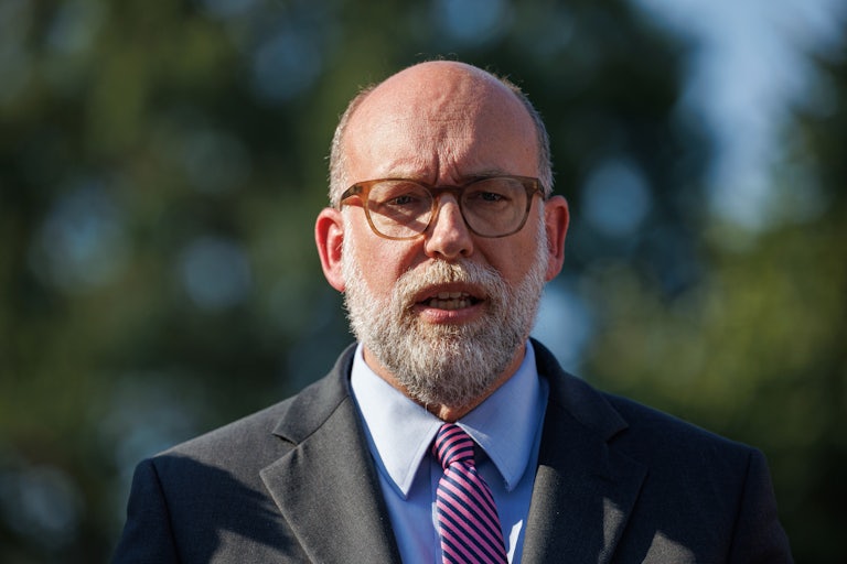 OMB Director Russell Vought speaks to reporters outside the White House