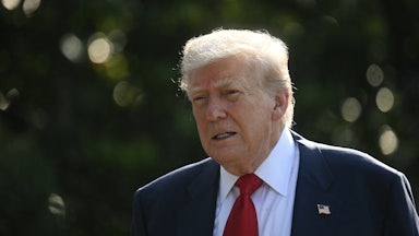 Trmp holds his mouth open slightly