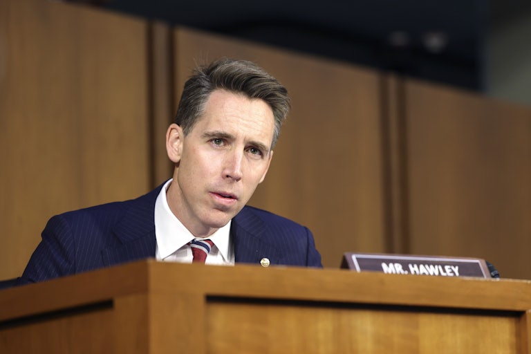 Senator Josh Hawley speaks in a hearing (his nameplate is before him)